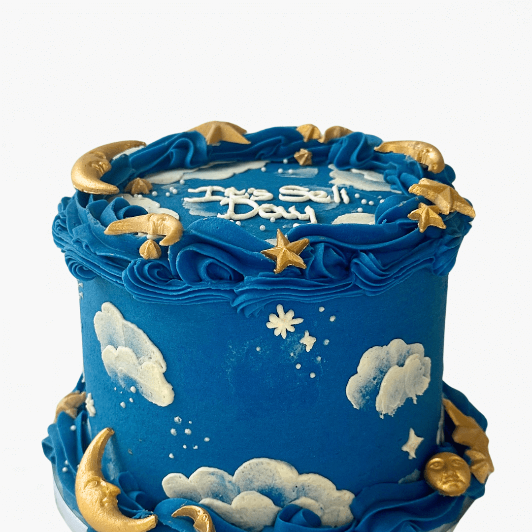 Blue cake with star and moon decorations on a white background - kids birthday cakes Sydney