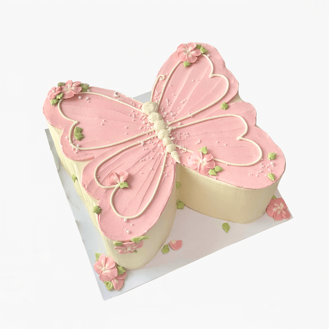 Butterfly-shaped cake with pink and beige colors on a white background - children's birthday cakes Sydney