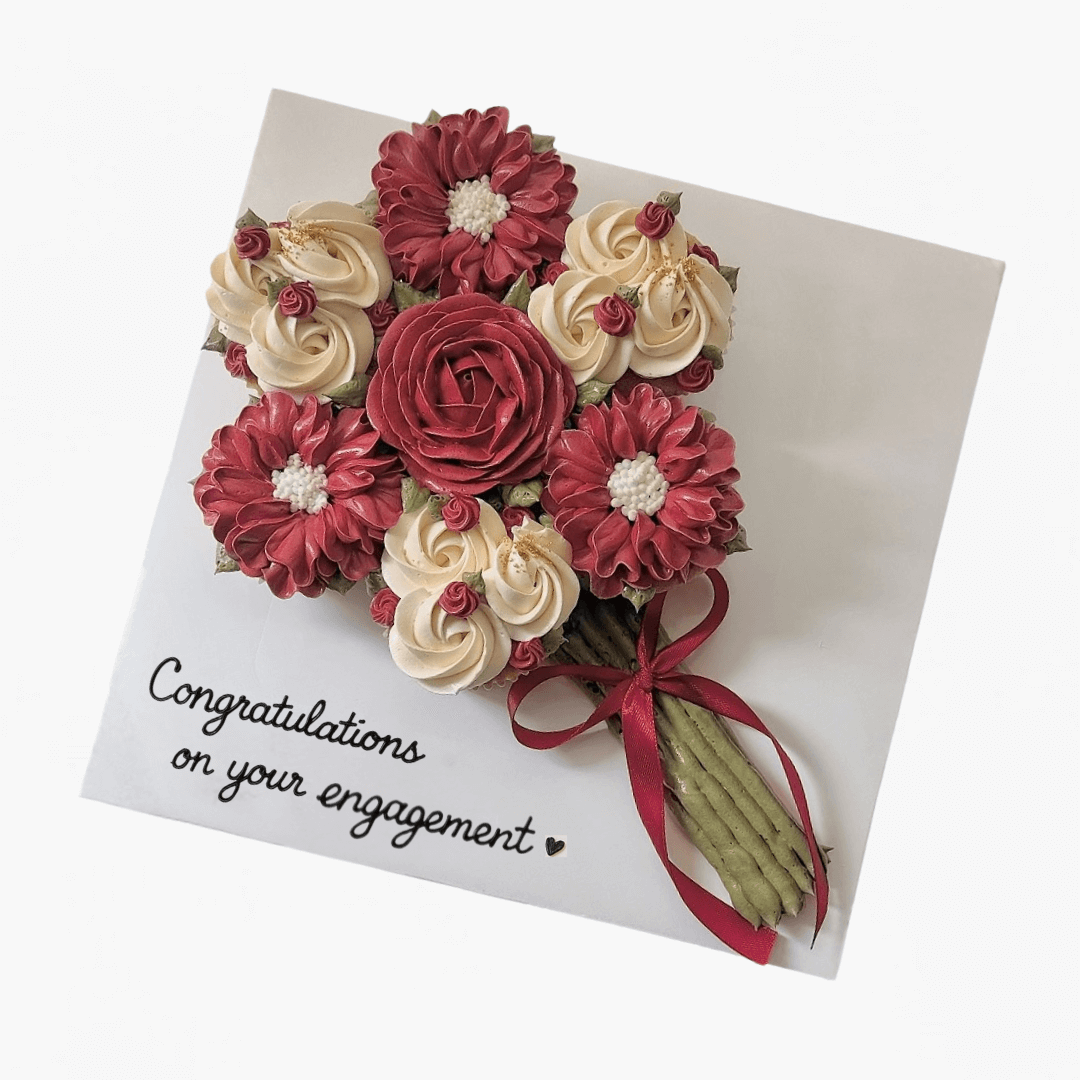 Card with red and beige floral design and 'Congratulations on your engagement' text.