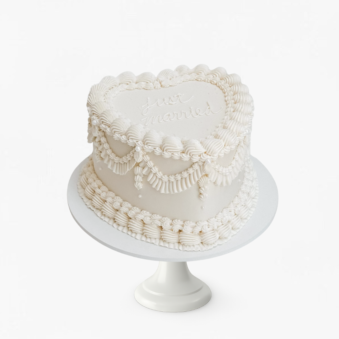 White Vintage heart cake with intricate designs - wedding cakes Sydney
