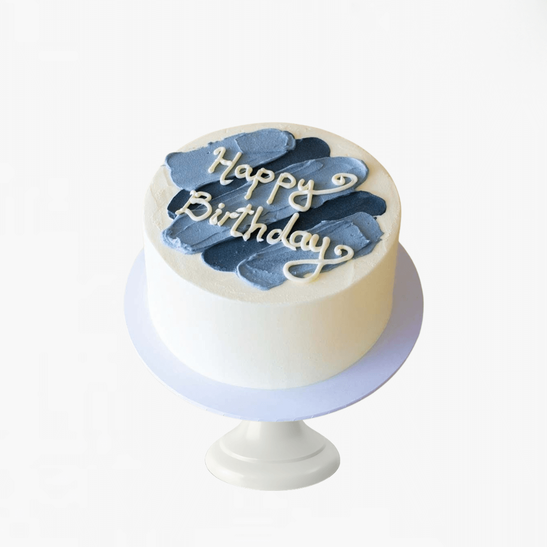 Small birthday cake with blue and white decorations on a white background - men's birthday cakes Sydney 