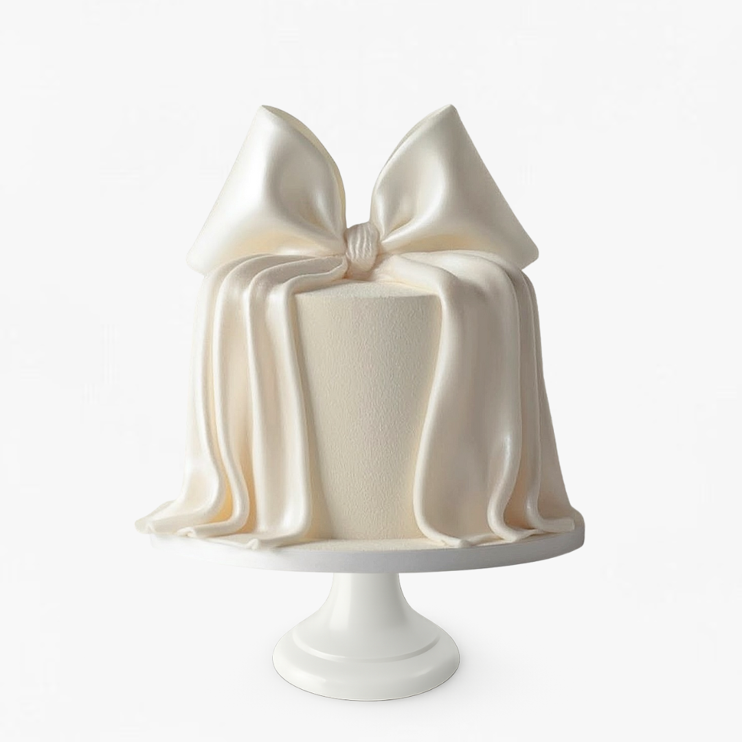 Decorative engagement cake with a large white bow - wedding cakes Sydney