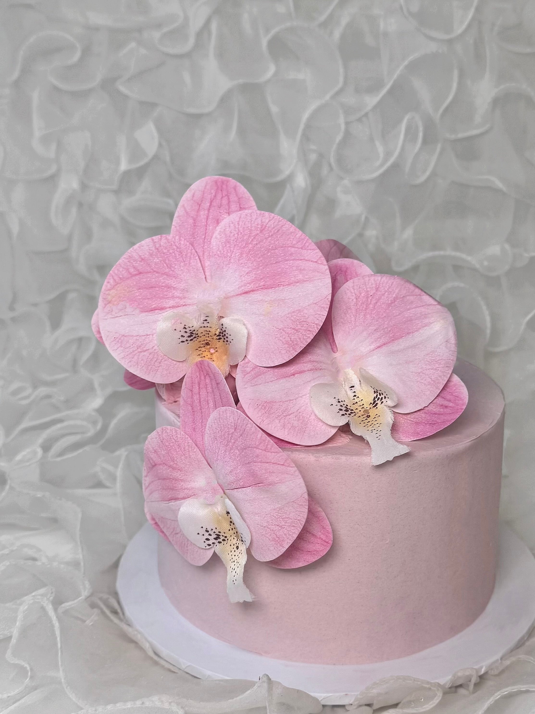 Pink cake with pink orchids 