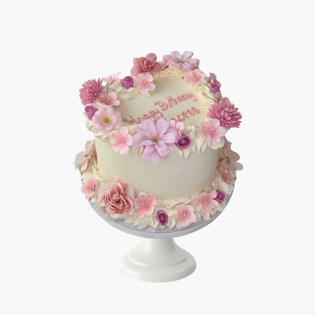Decorative cake with pink flowers on a white background - children's birthday cakes Sydney 