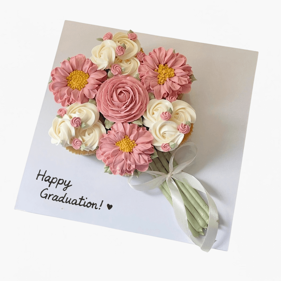 Bouquet of pink and white flowers on a card with 'Happy Graduation!' text.
