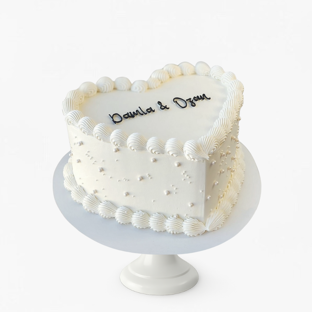 Heart-shaped vintage white cake with decorative pearls - wedding cakes Sydney 