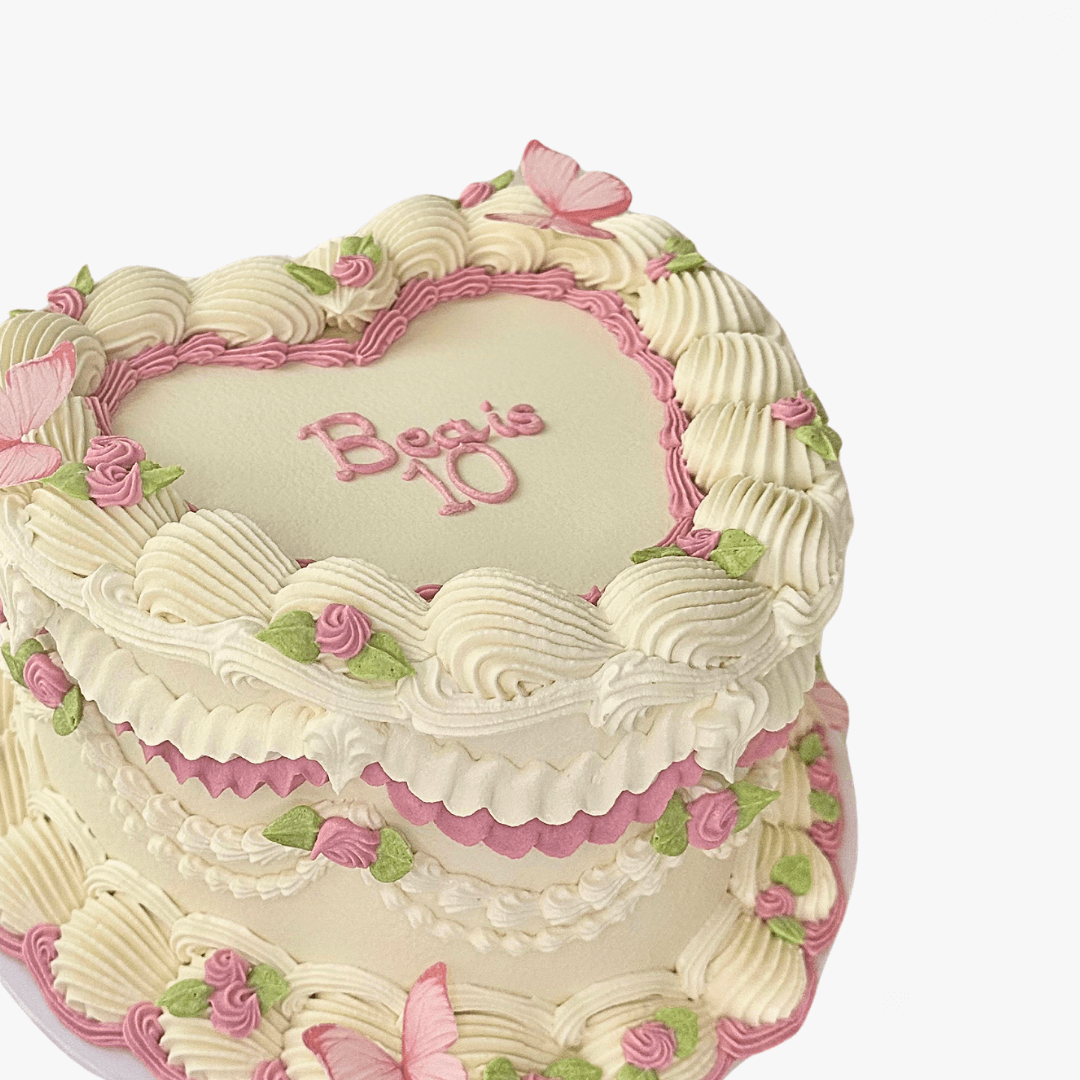 Decorative cake with pink and green accents on a white background - custom cakes Sydney 
